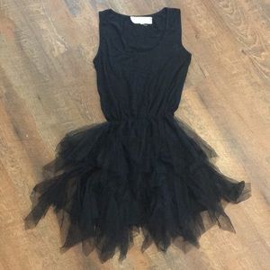 Small black boutique dress with short tool skirt